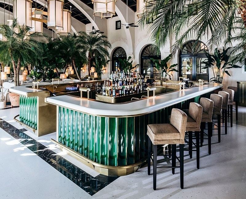 Ranieri glazed lava stone bar counter — deep green 3D tiles, luxury hospitality interior